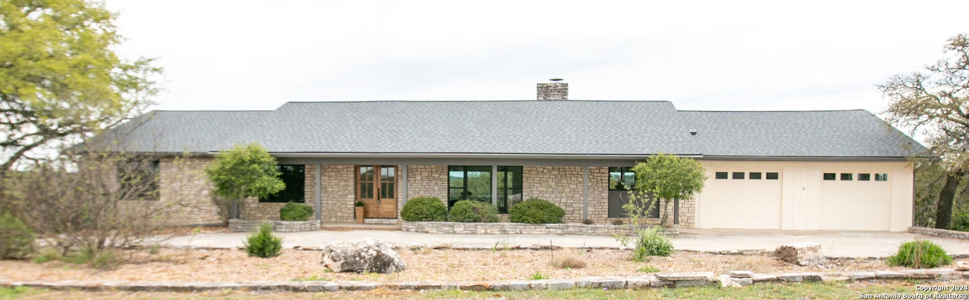 a front view of a house with garden