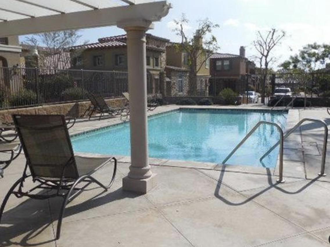 a patio with table and chairs