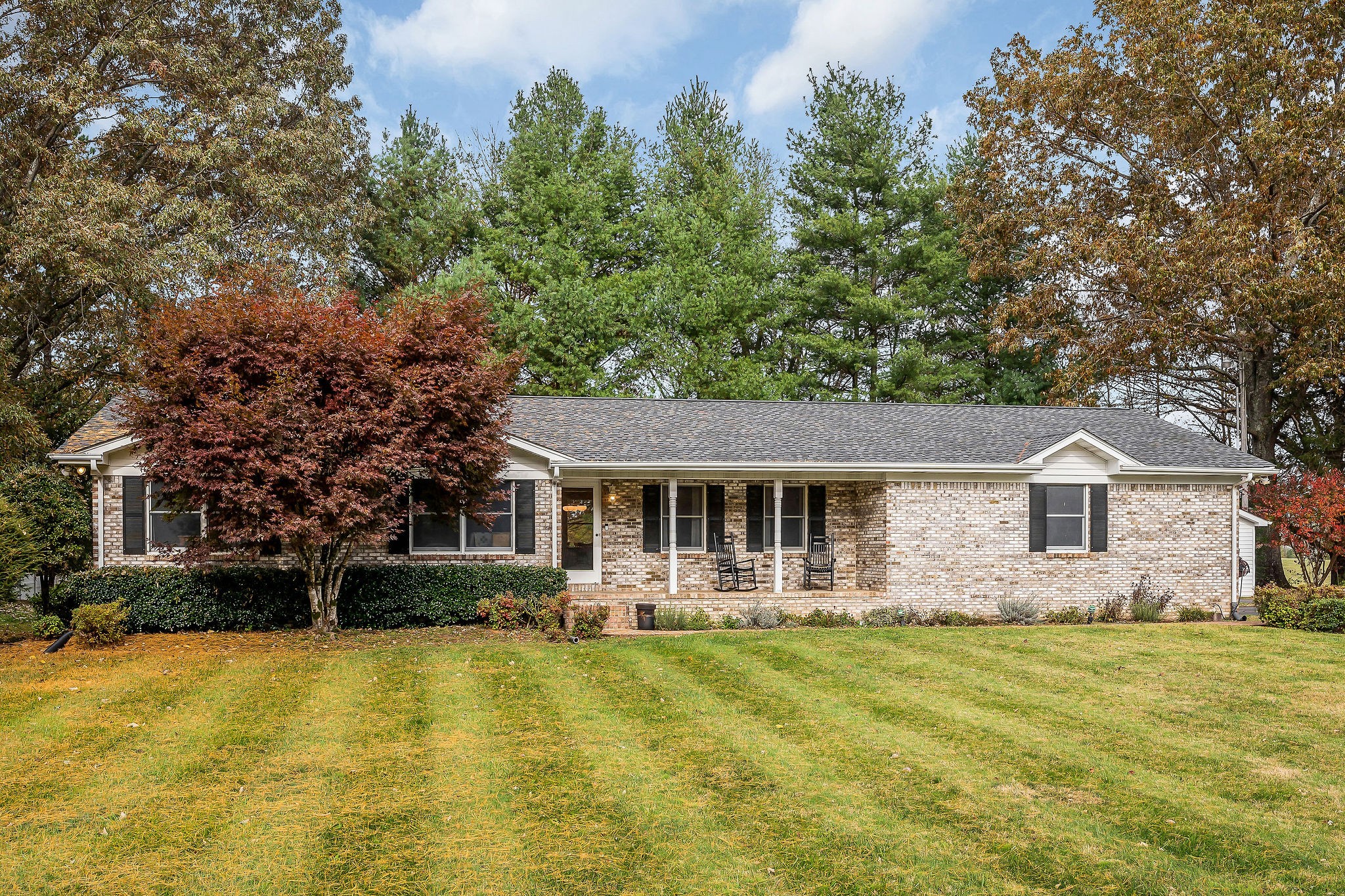 a front view of a house with garden