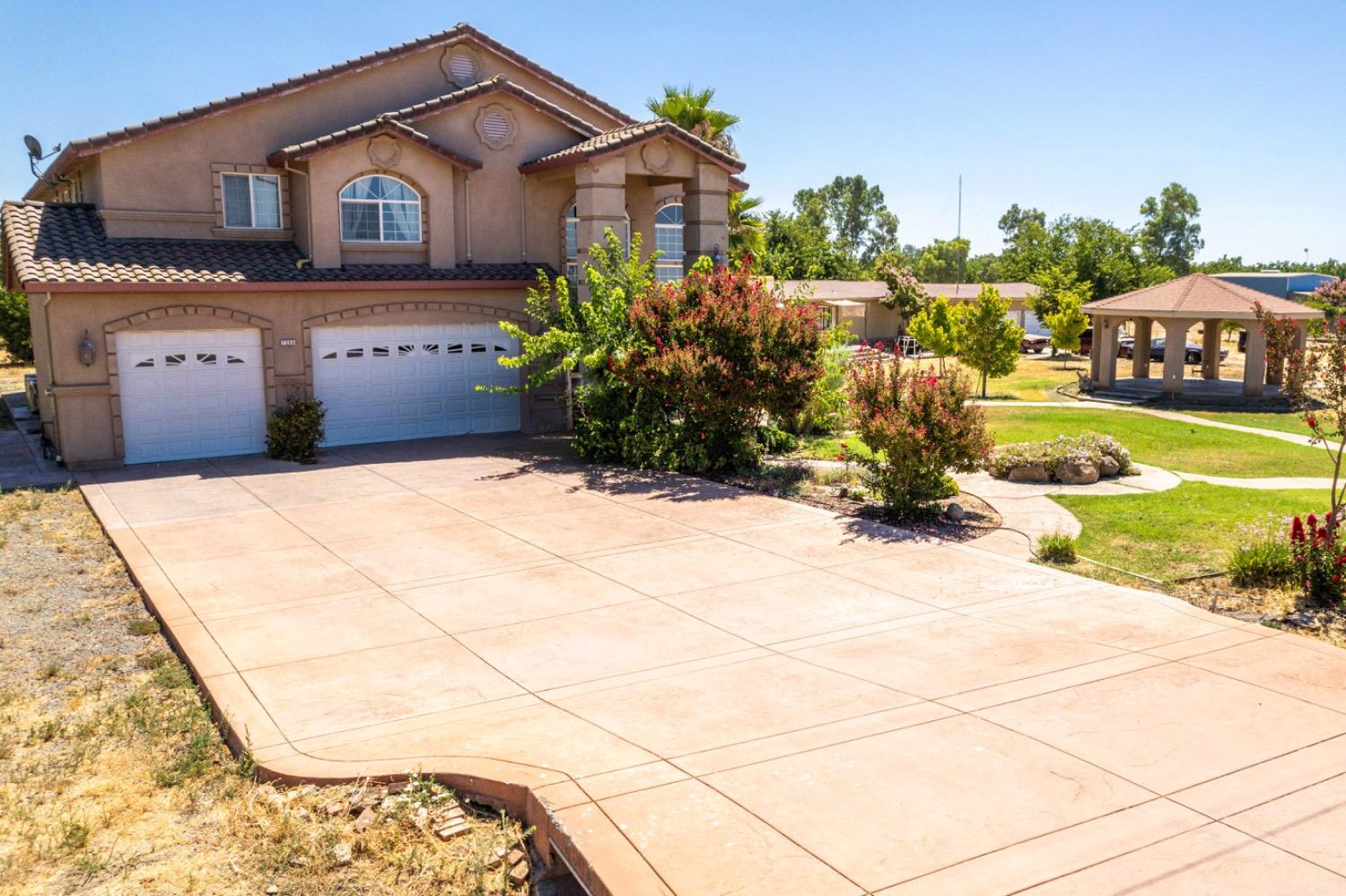 a house view with a garden space