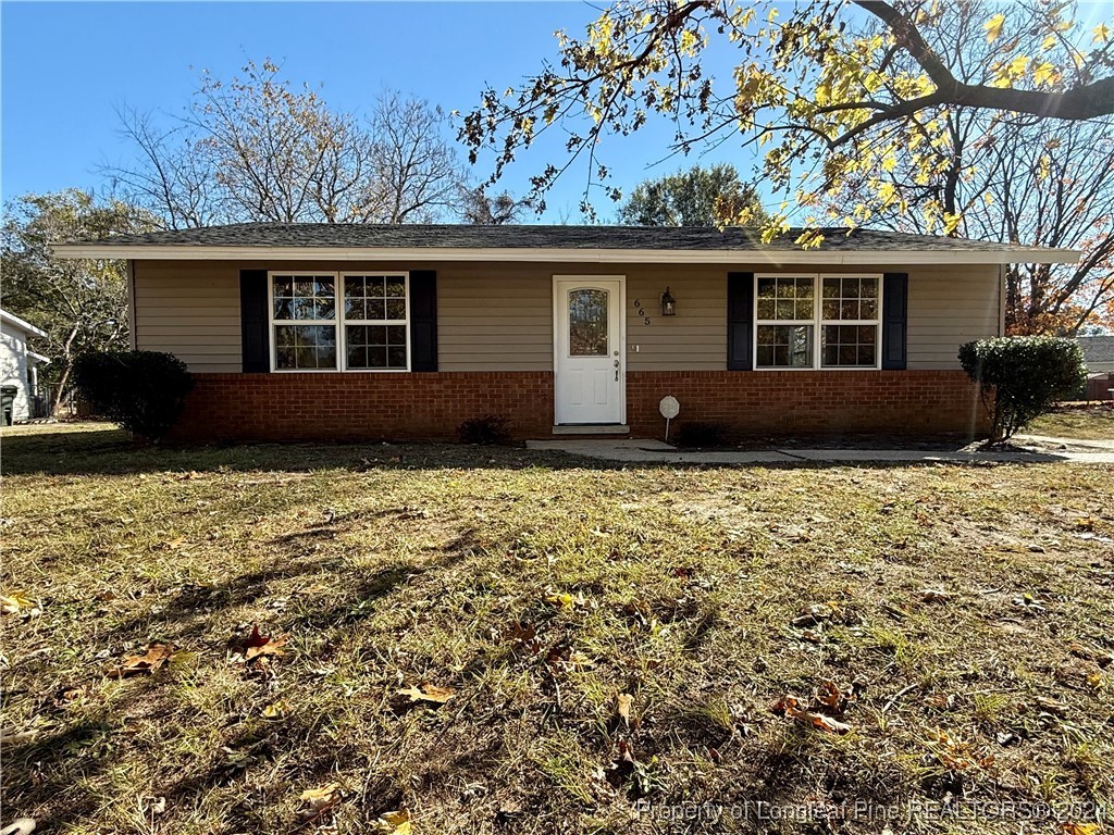 front view of a house with a yard