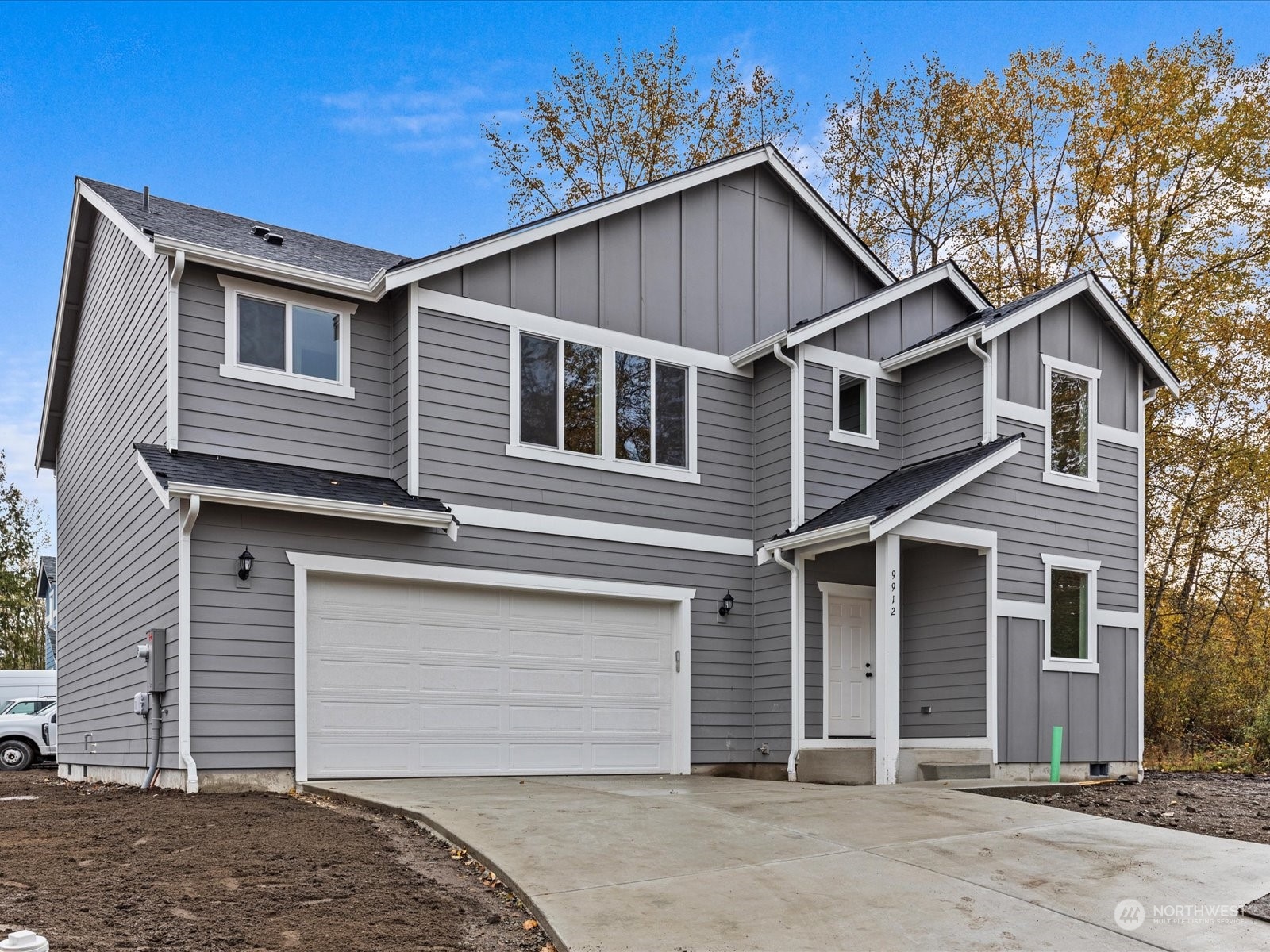 a front view of a house with a garage