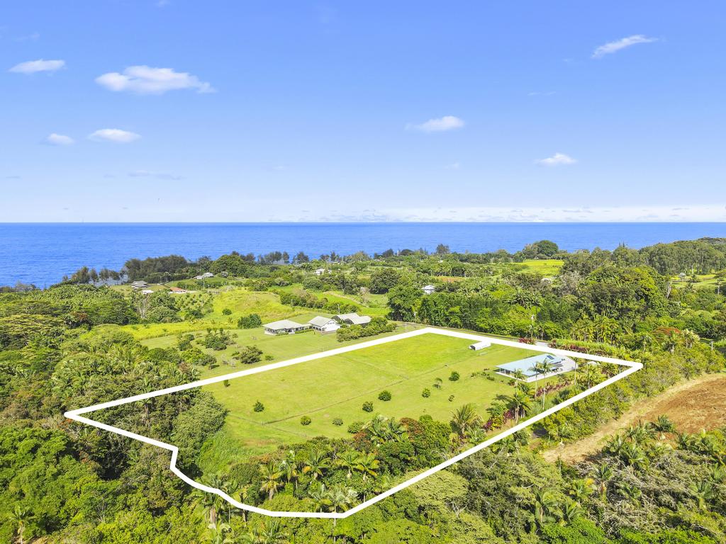 Over five acres of prime Hamakua coast land, with a custom home and year-round stream.  Boundaries are approximate.