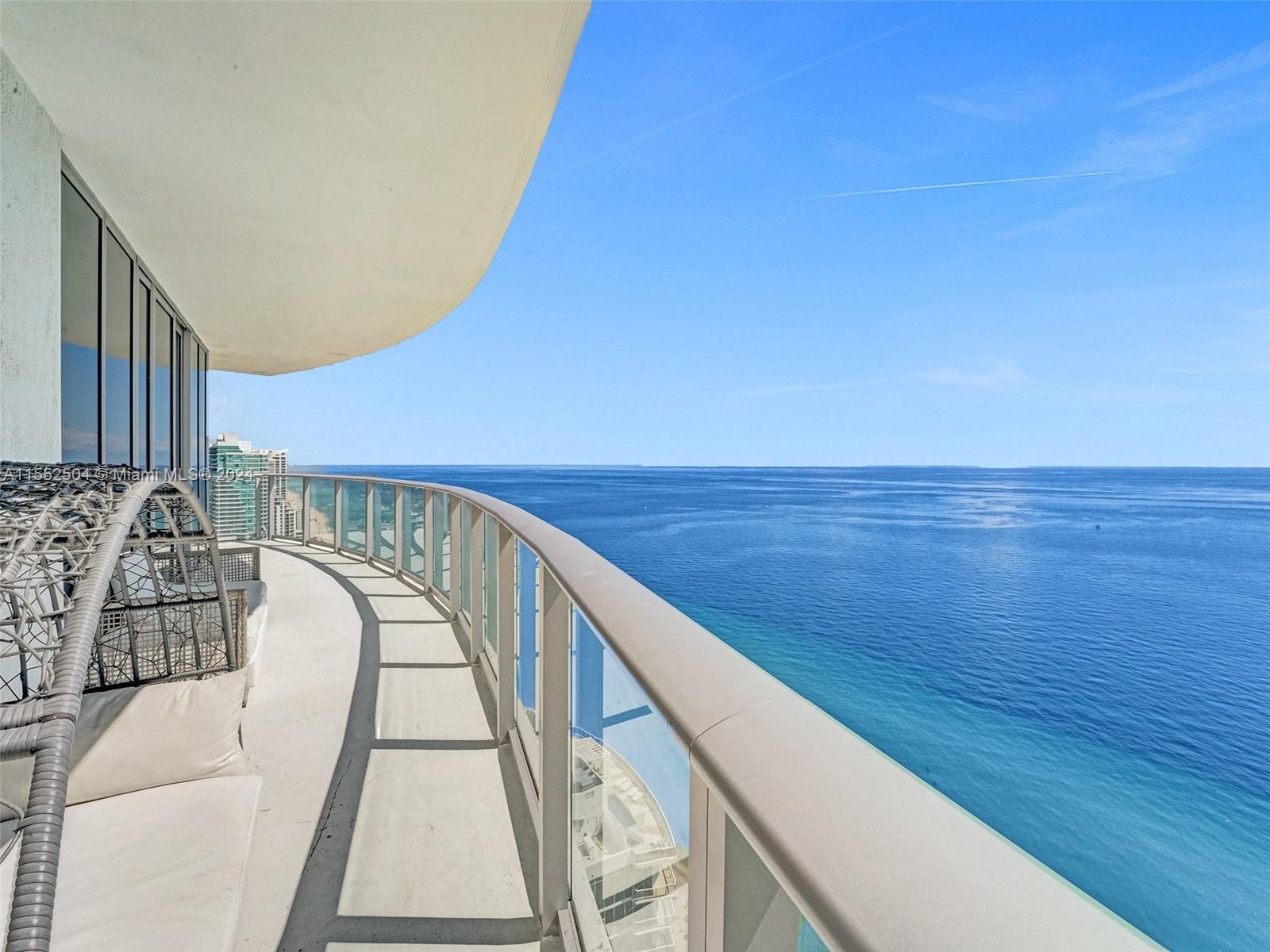 a view of balcony with furniture