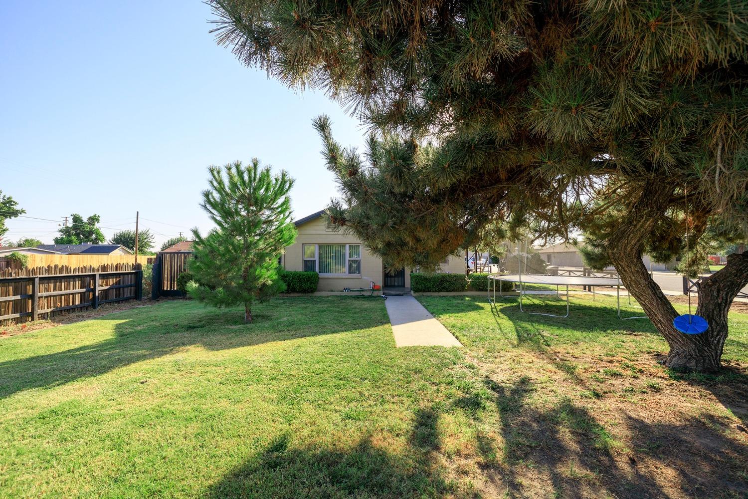 a view of backyard with green space