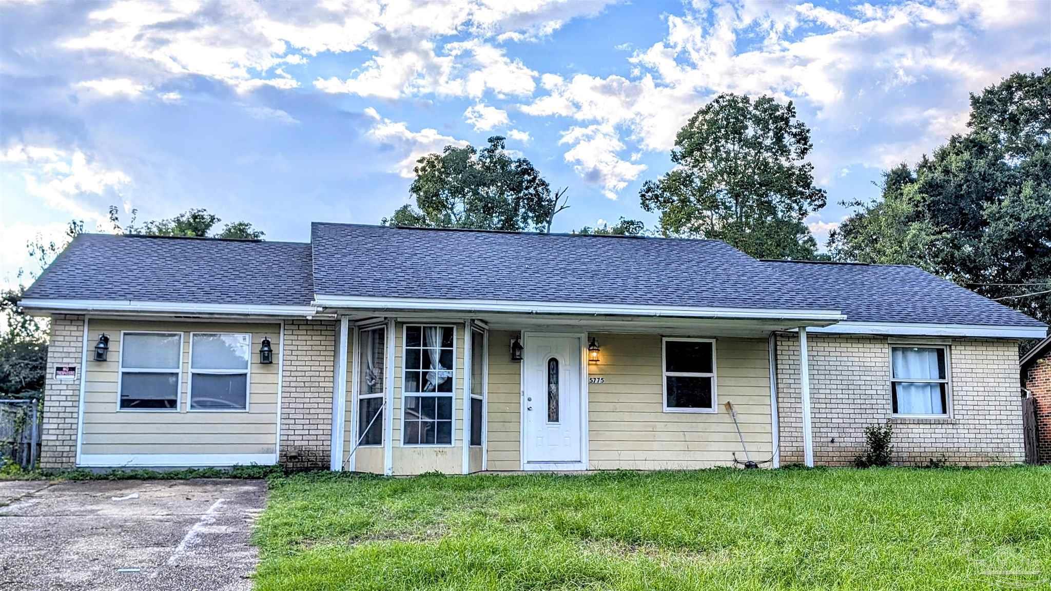 front view of a house with a yard