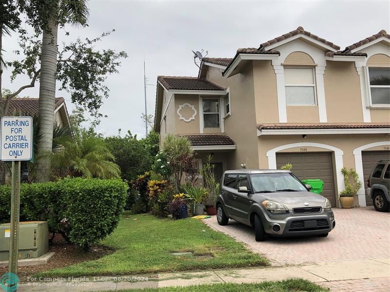 a car parked in front of a house