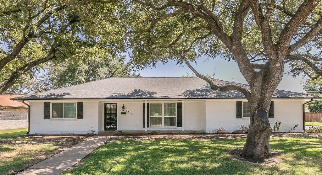 Single story home with a front lawn