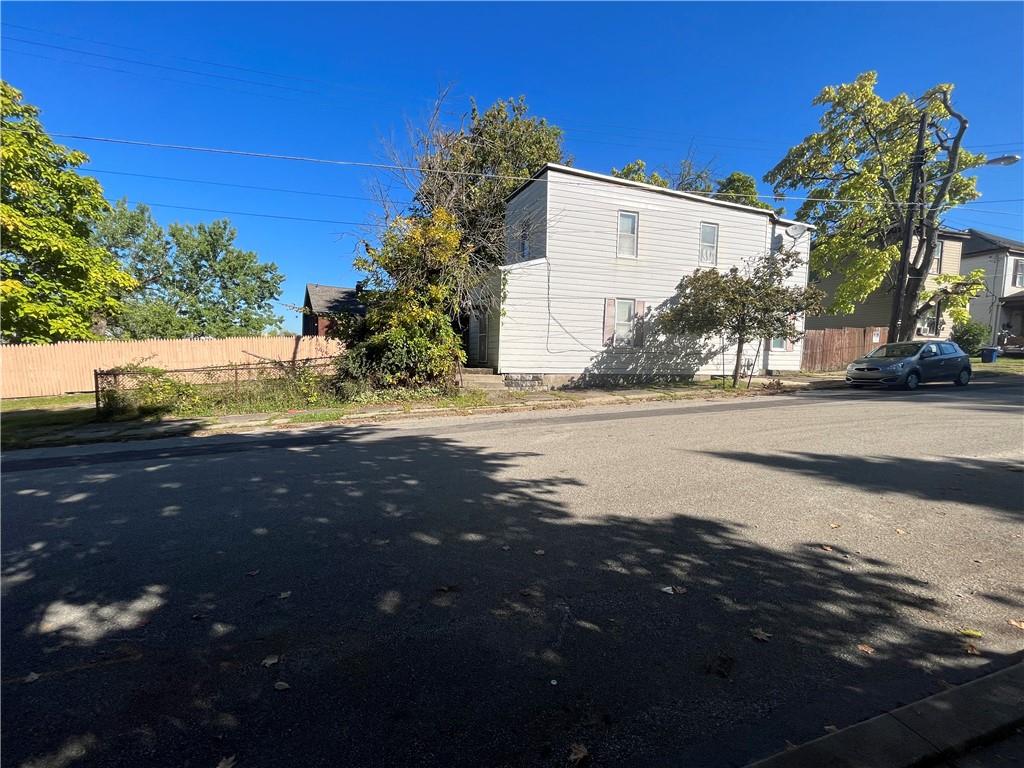 a view of a street and a yard