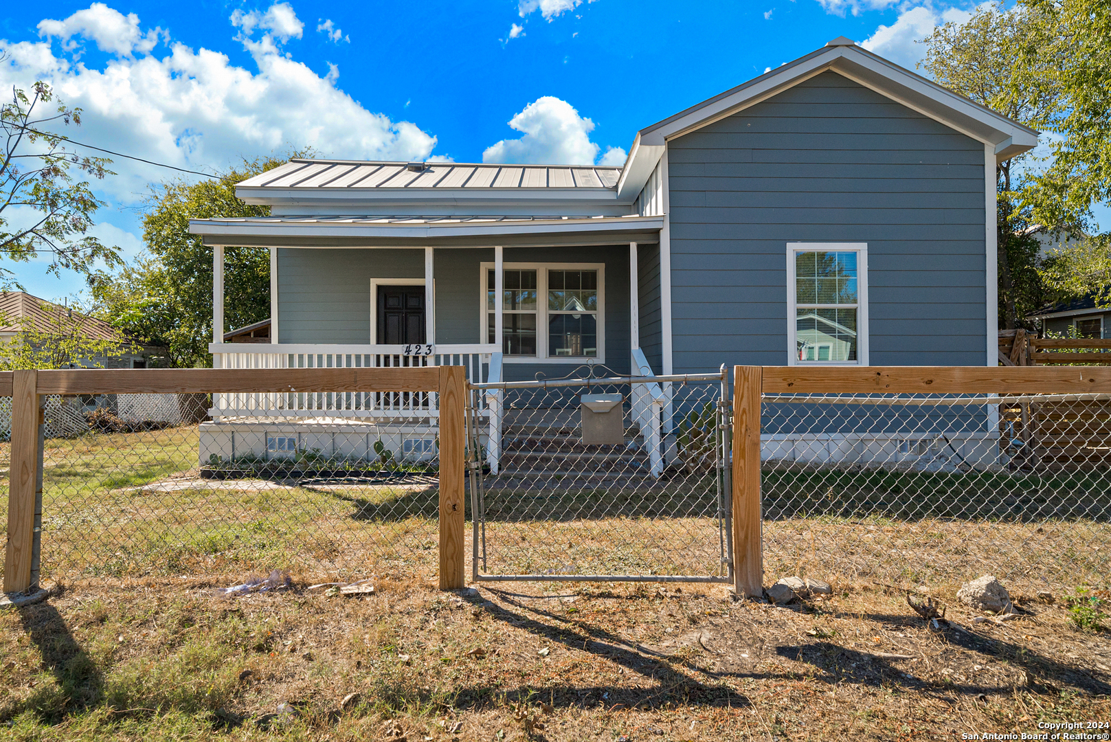 front view of a house with a yard