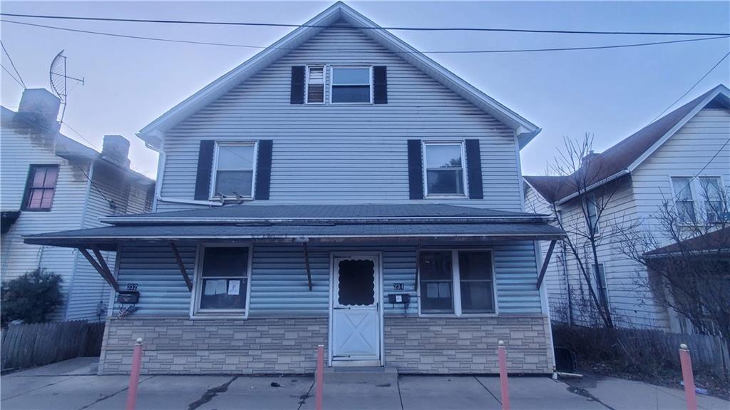 a front view of a house with garage