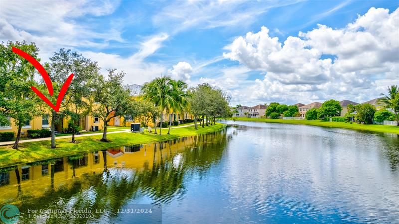 a view of a lake with houses in the back