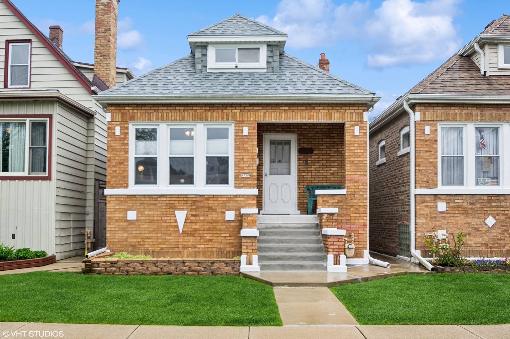 a front view of a house with a yard