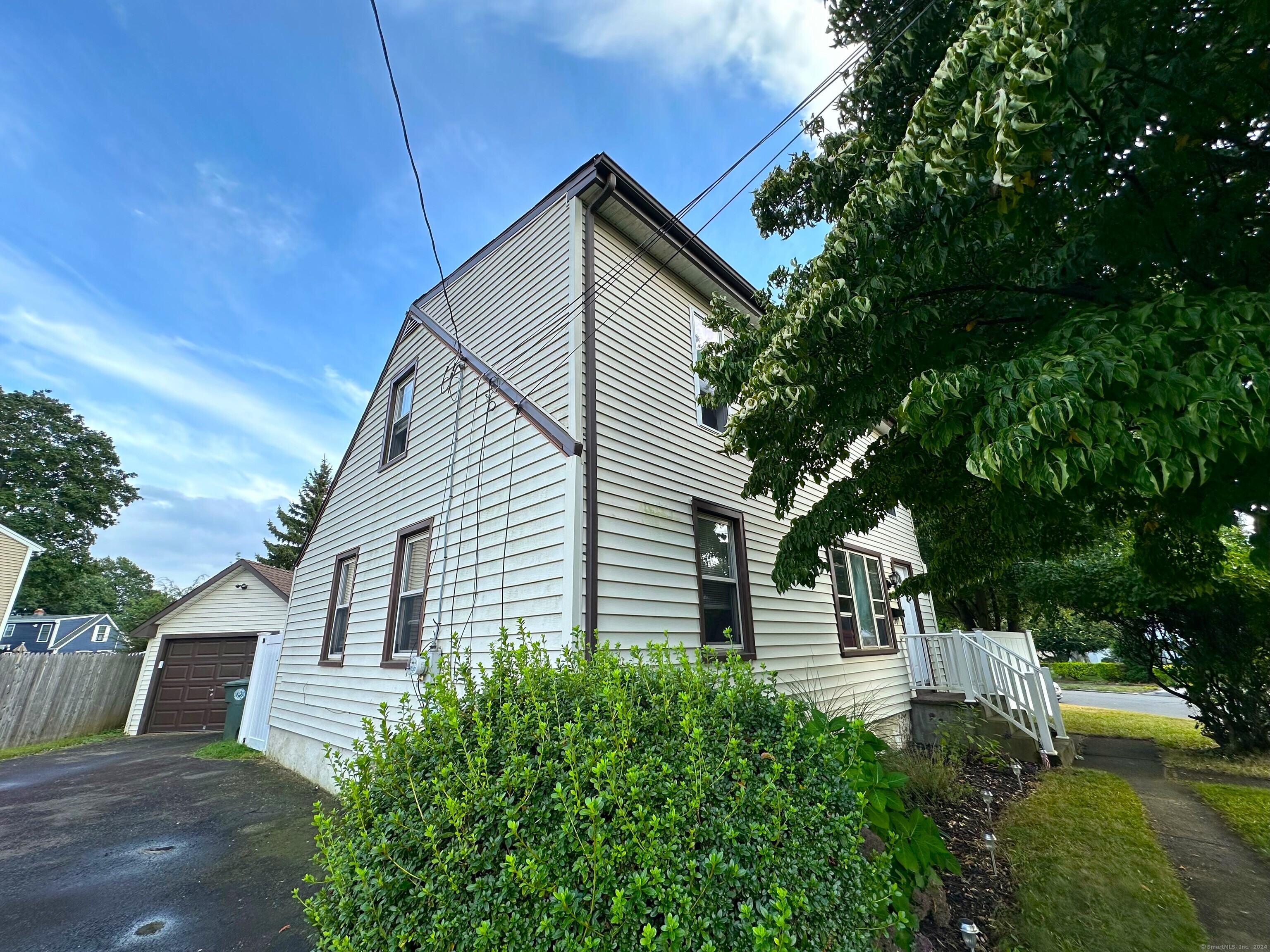 a view of house with backyard