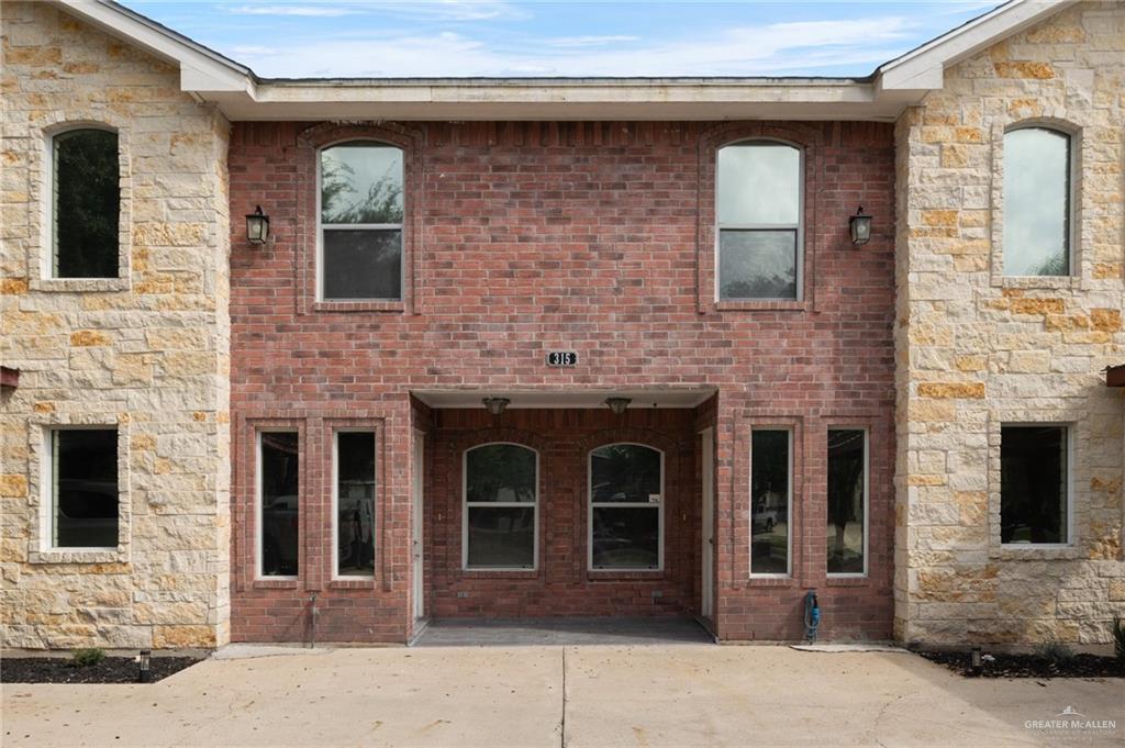 Back of property with a patio