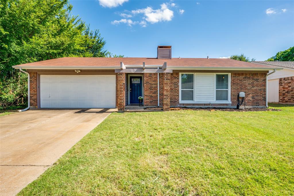 a front view of a house with yard