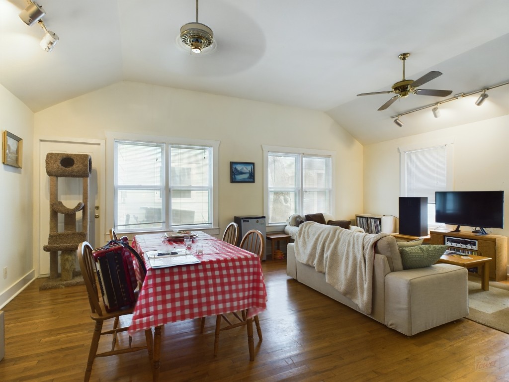 a living room with furniture fireplace and a window