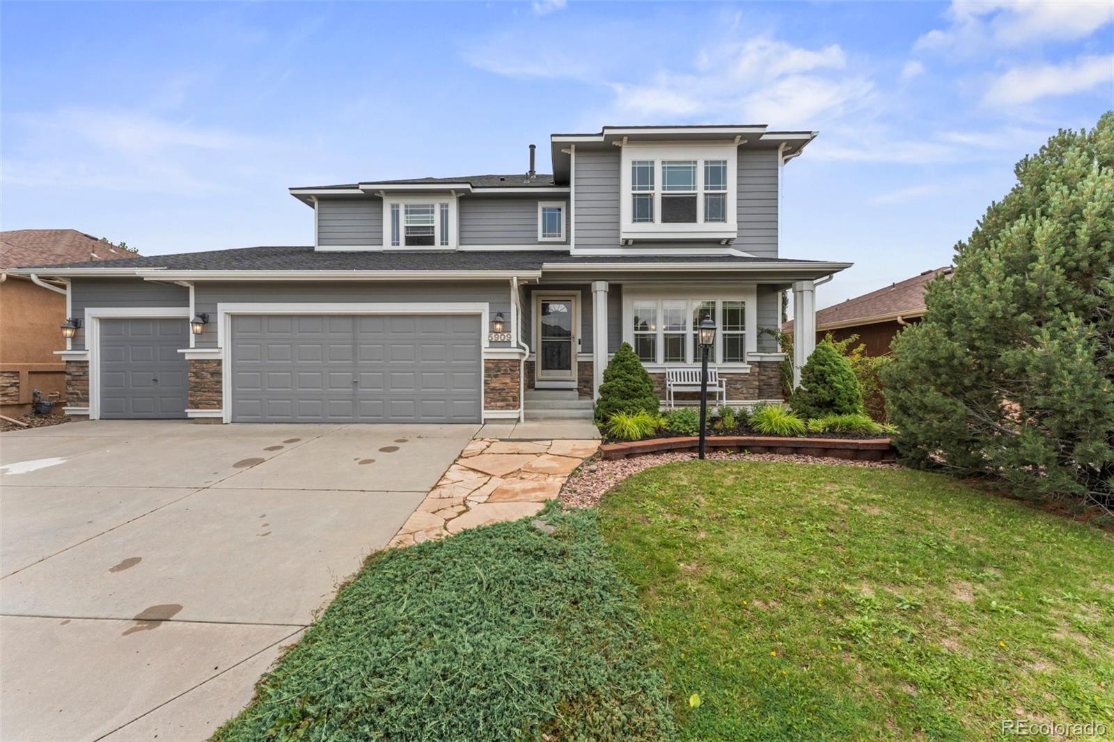 front view of a house with a yard