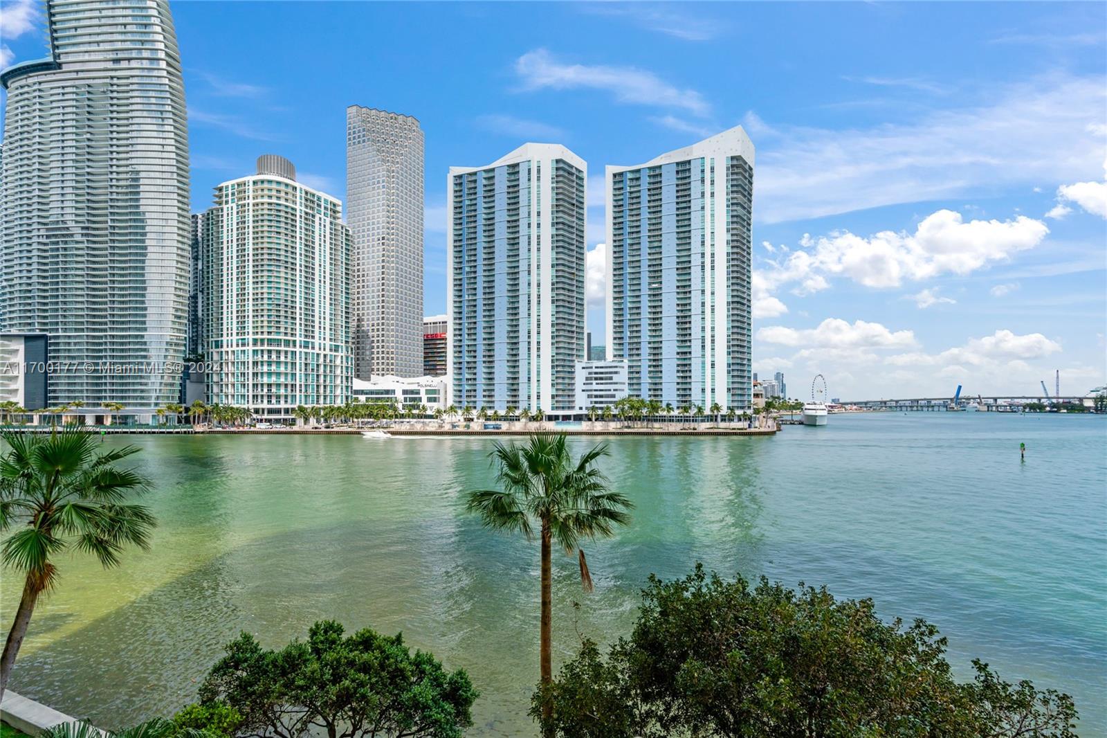 a view of a lake with tall building