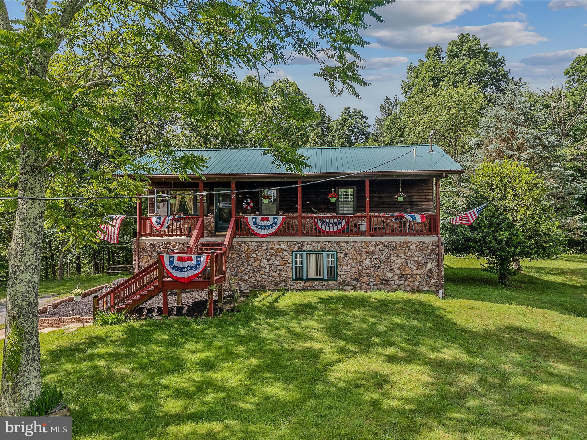 a view of a house with a yard porch and sitting area