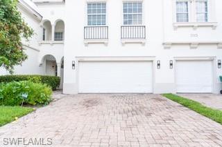 View of front of property with a garage