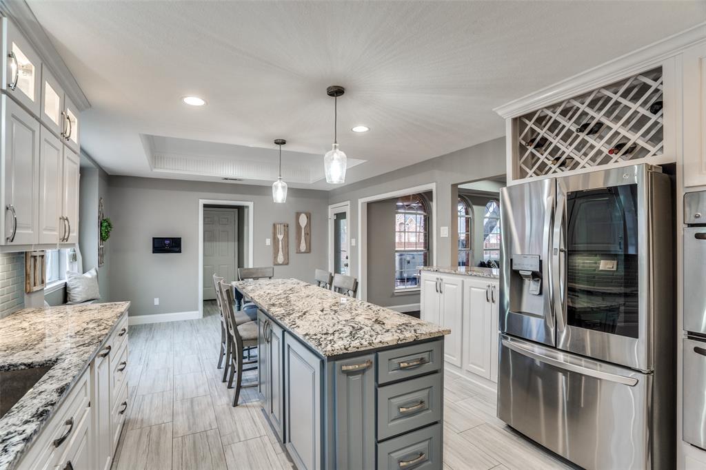 a kitchen with a stove and refrigerator