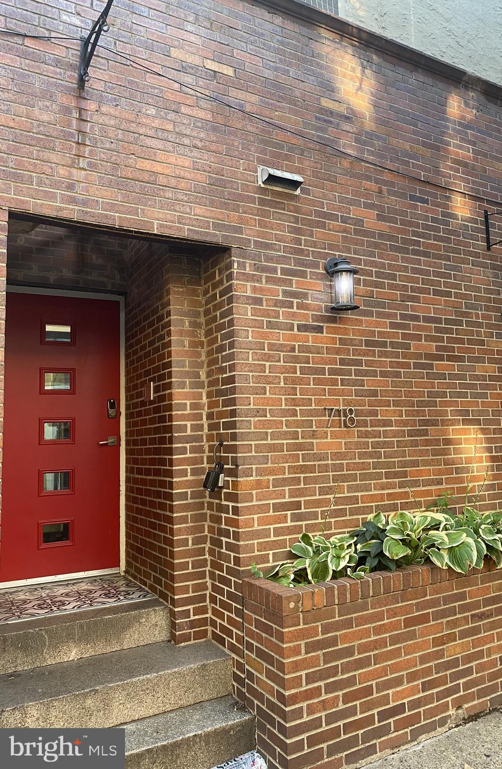 a view of a brick door of the house