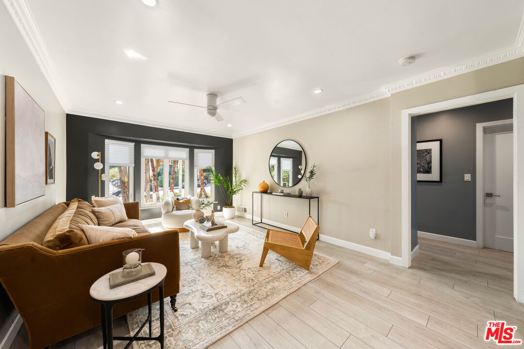 a living room with furniture and a rug