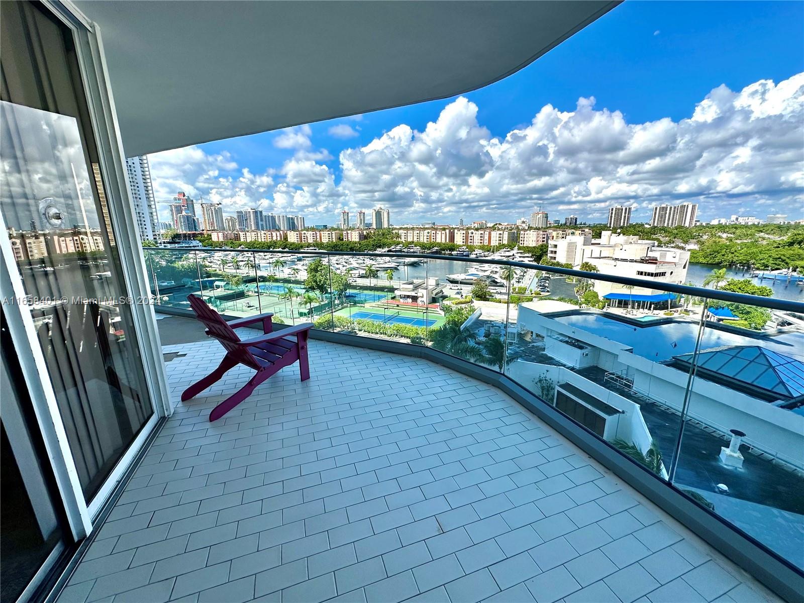 a view of a chairs and table in the balcony