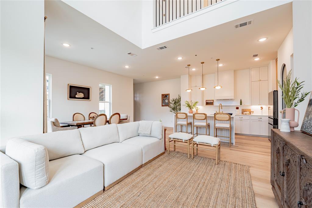 a view of a living room kitchen with a table and chairs