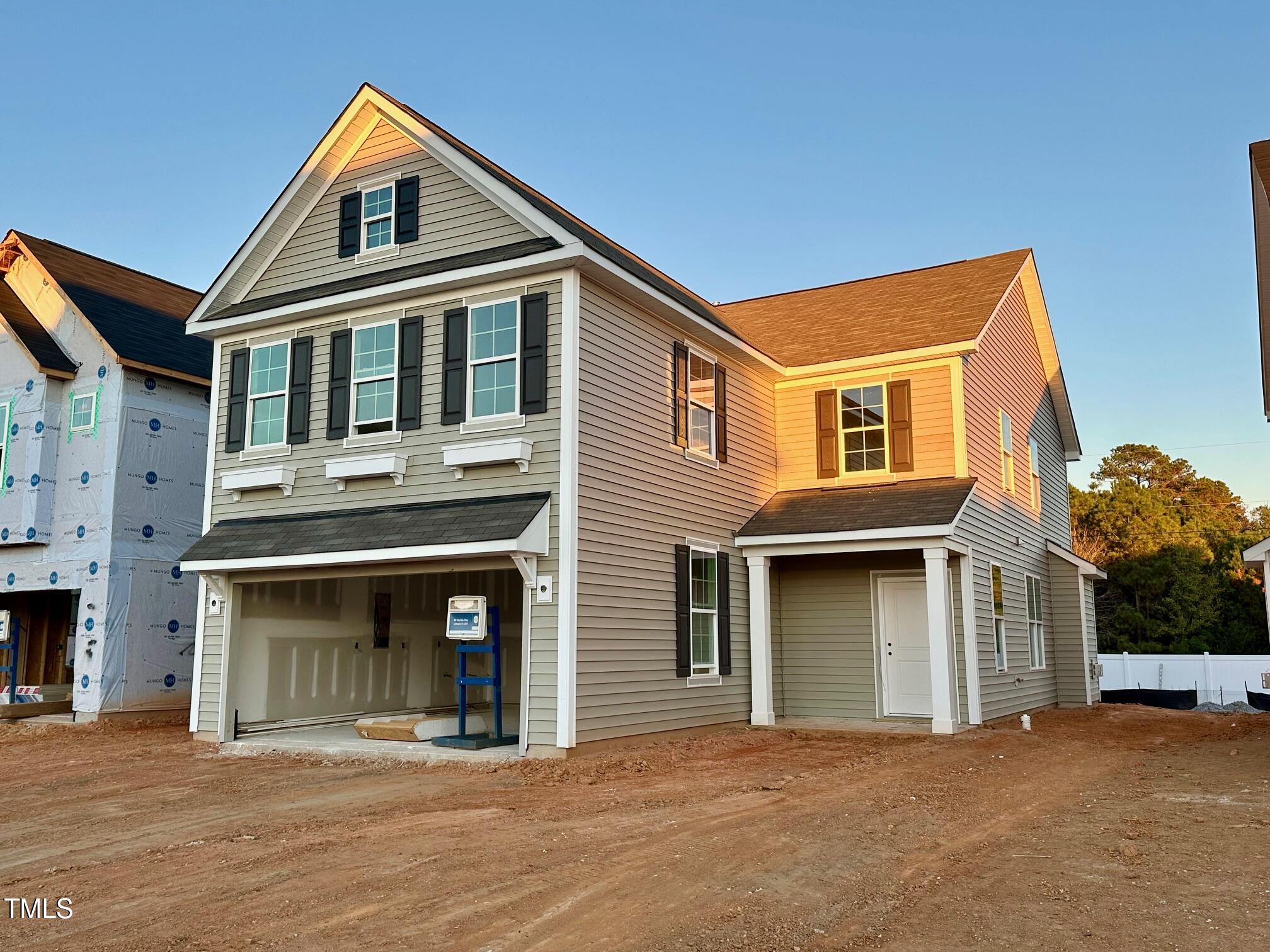 a front view of a house with a garage