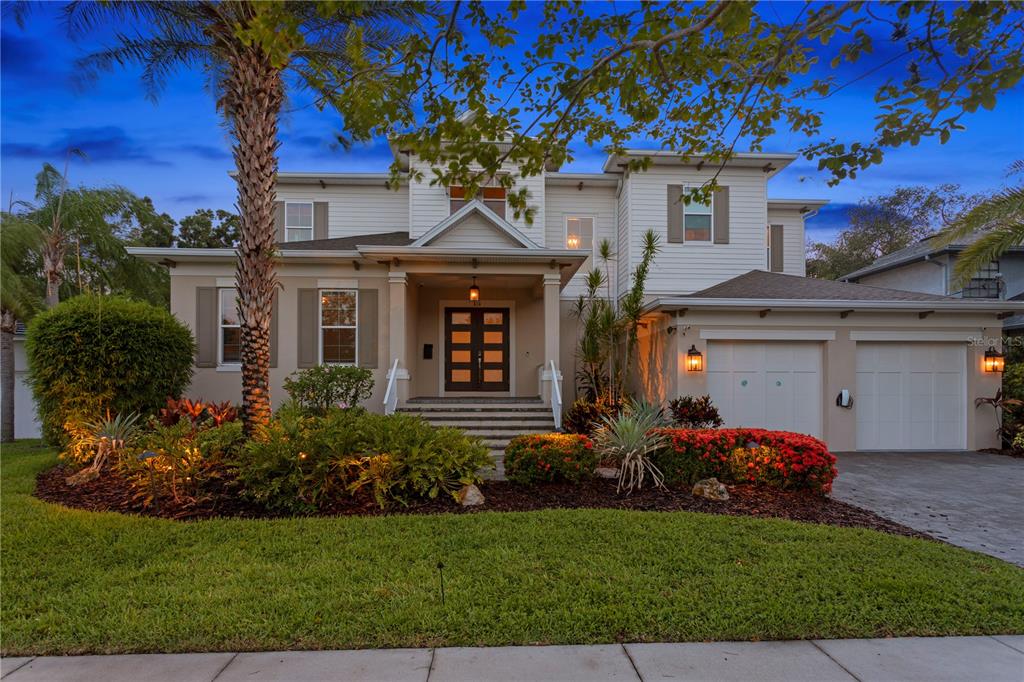 a front view of a house with garden