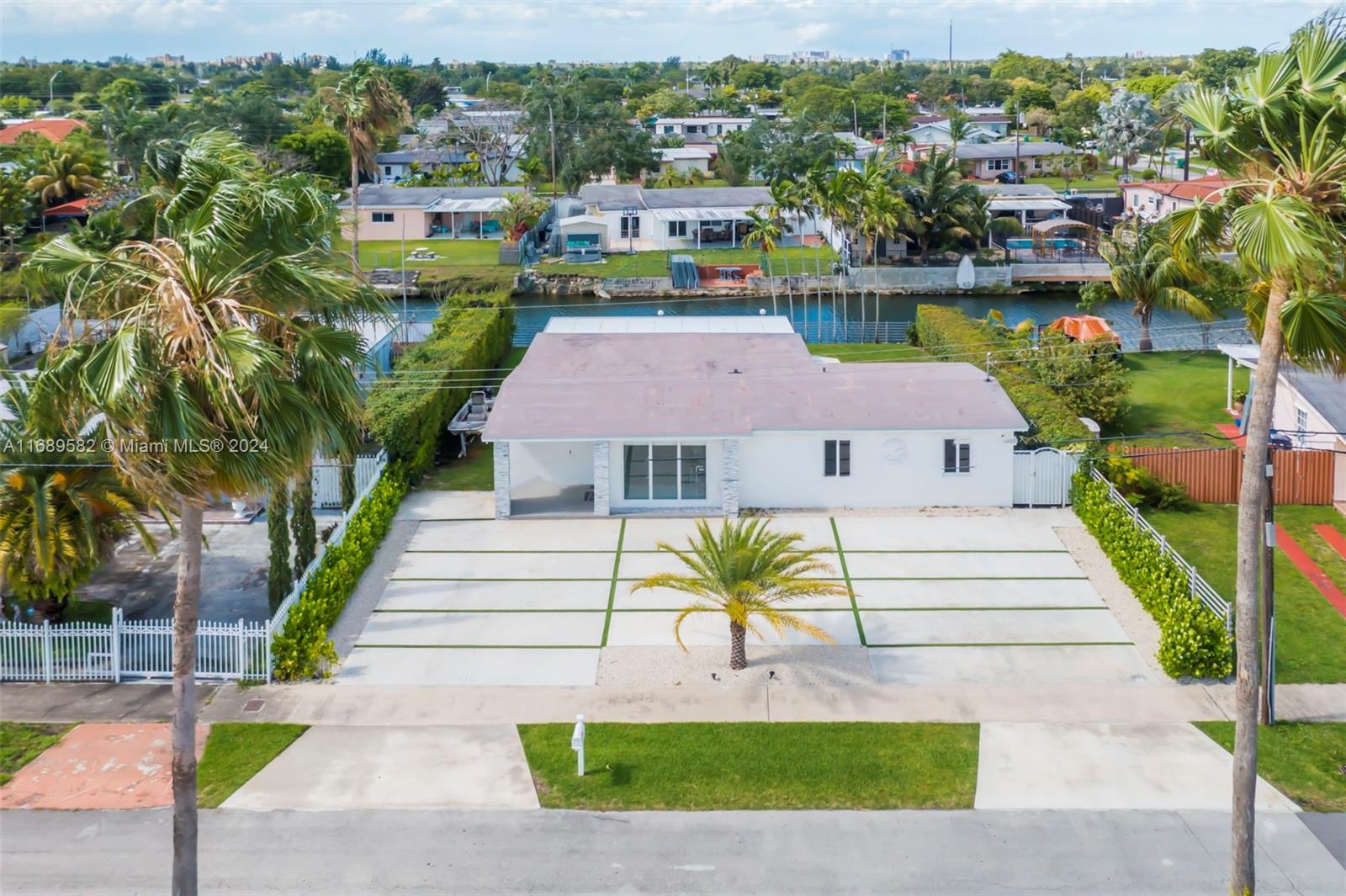 an aerial view of a house with a yard table and chairs potted plants