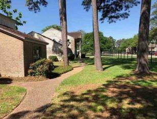 a view of a backyard of the house