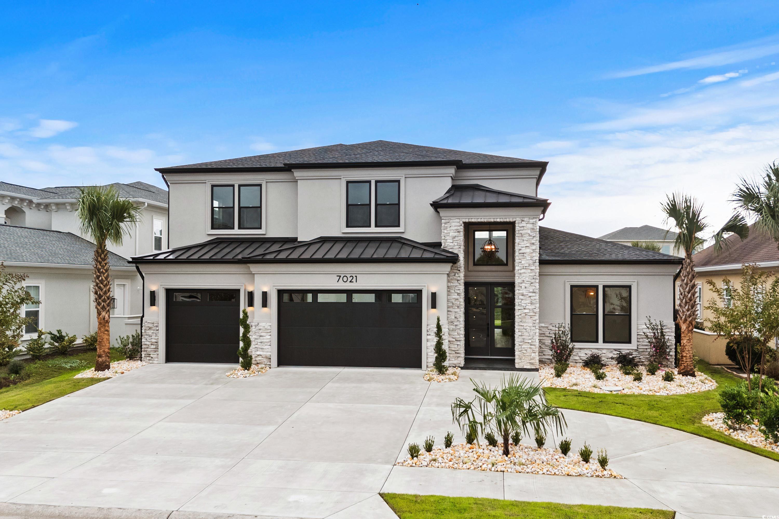 View of front of house with a garage