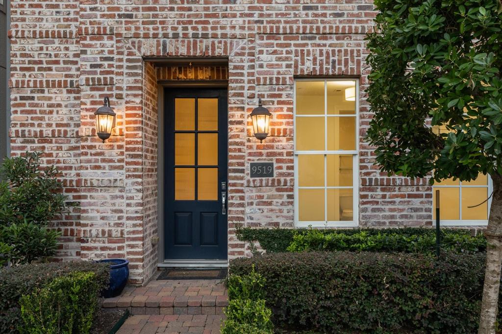 a view of a brick house with a large windows