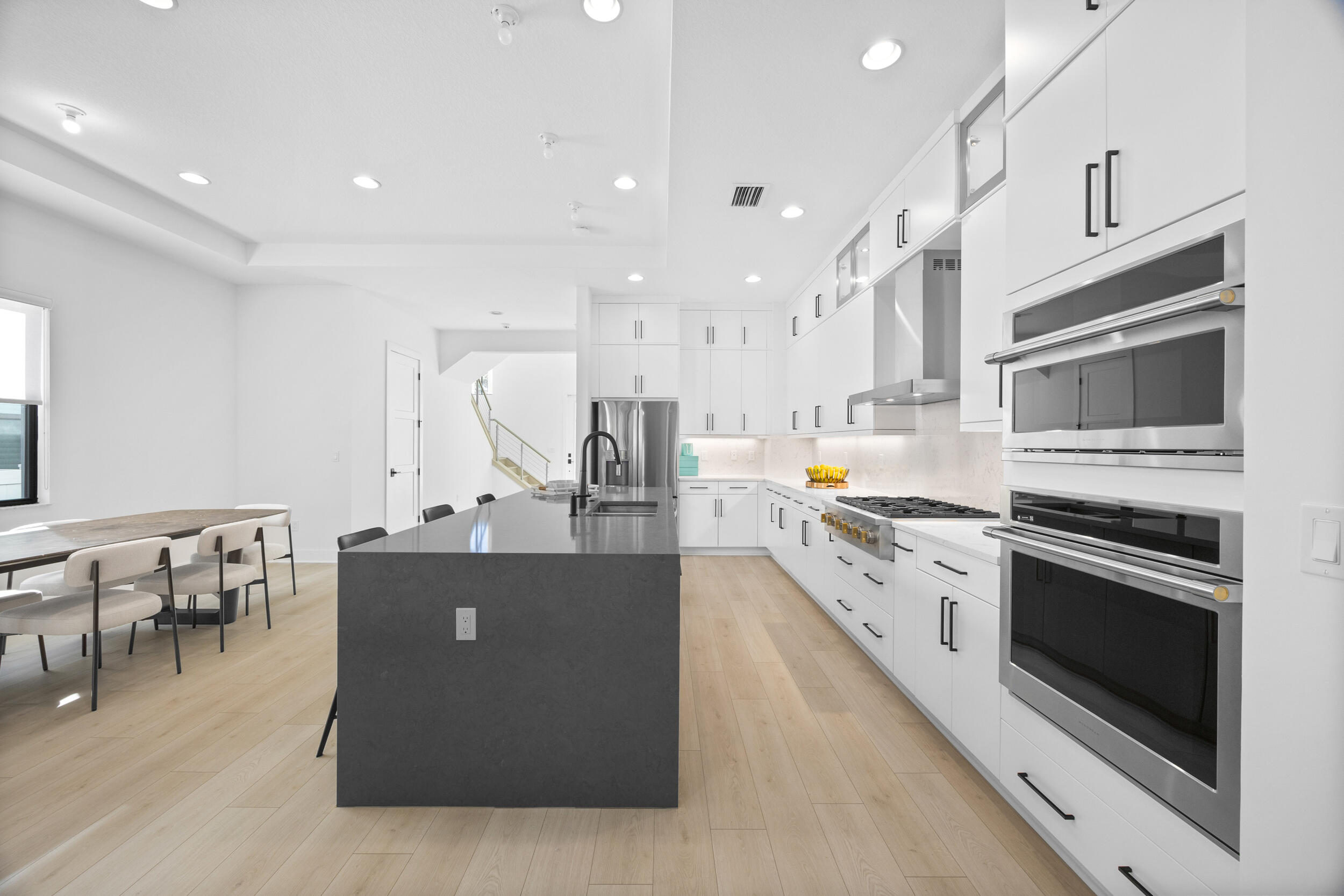 a large kitchen with stainless steel appliances