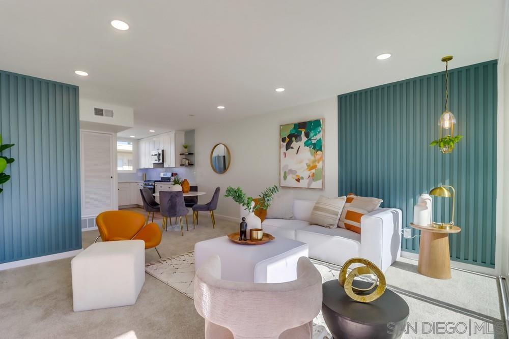 a living room with furniture and clutter