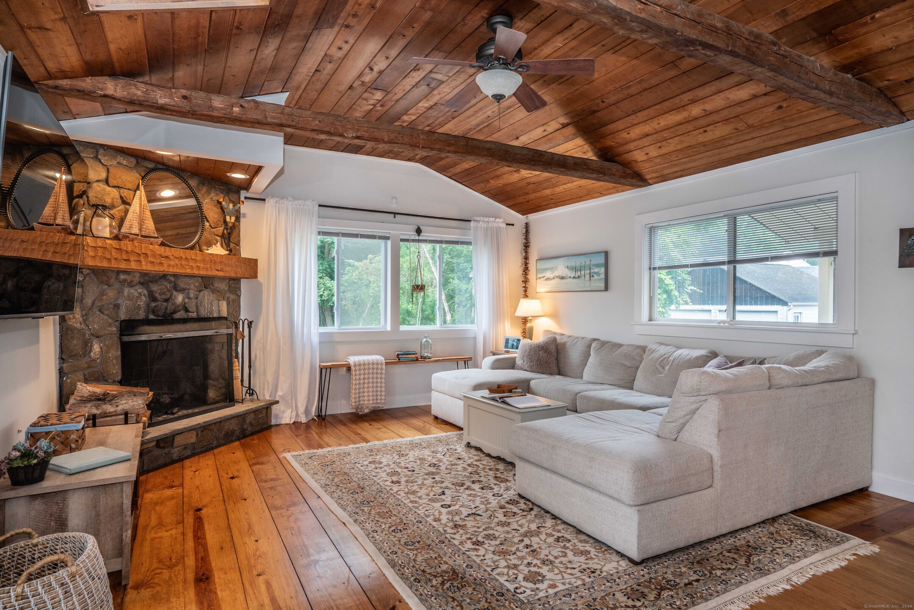 a living room with furniture and a fireplace