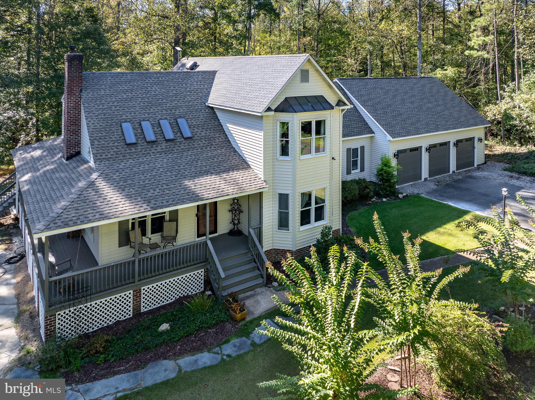 a aerial view of a house with a yard