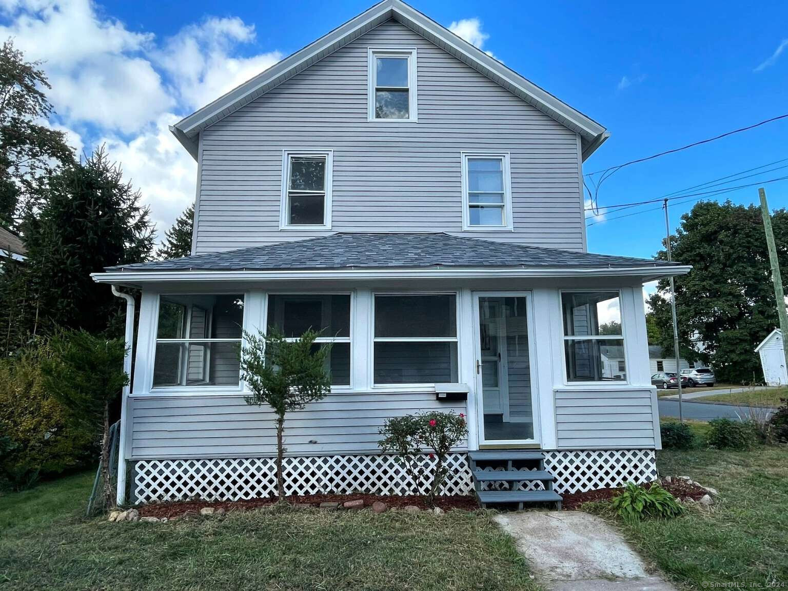 a view of a house with a yard