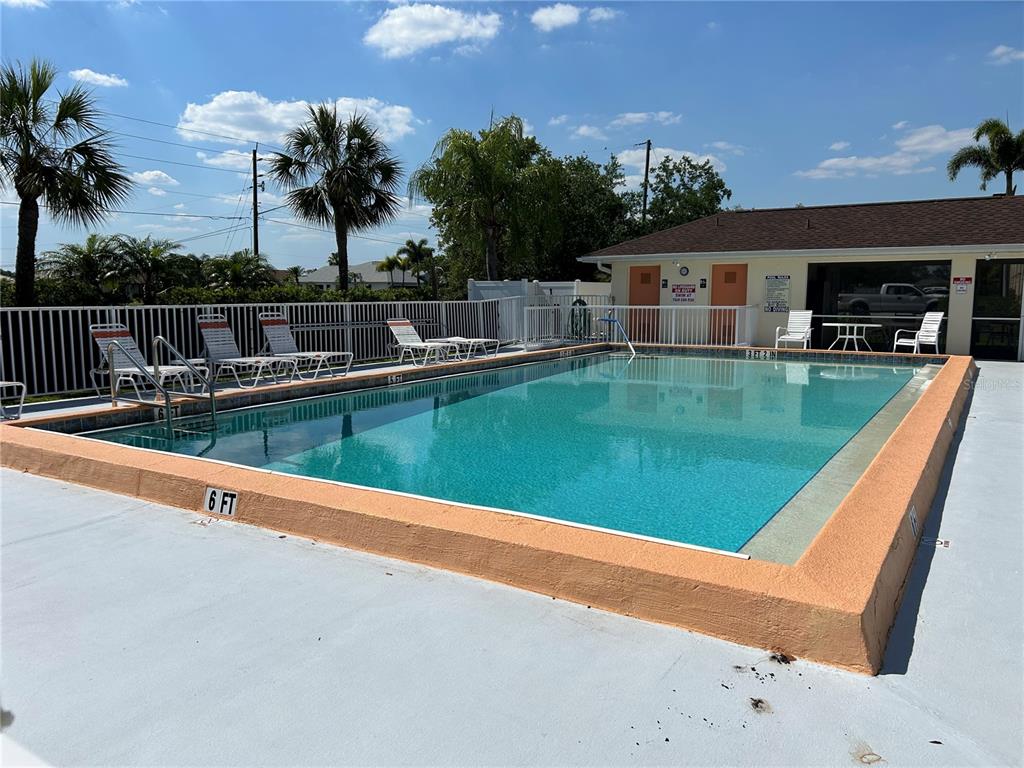 swimming pool view with a outdoor seating space