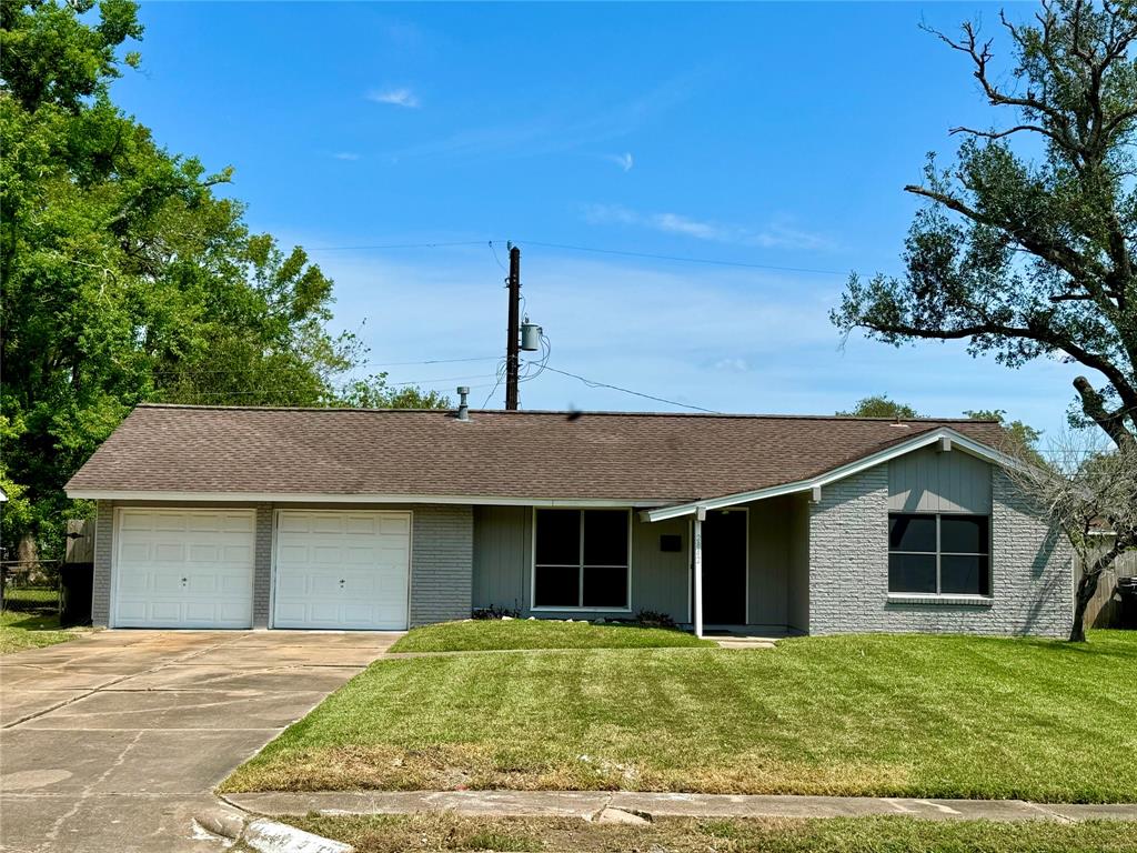 Front of home with long driveway