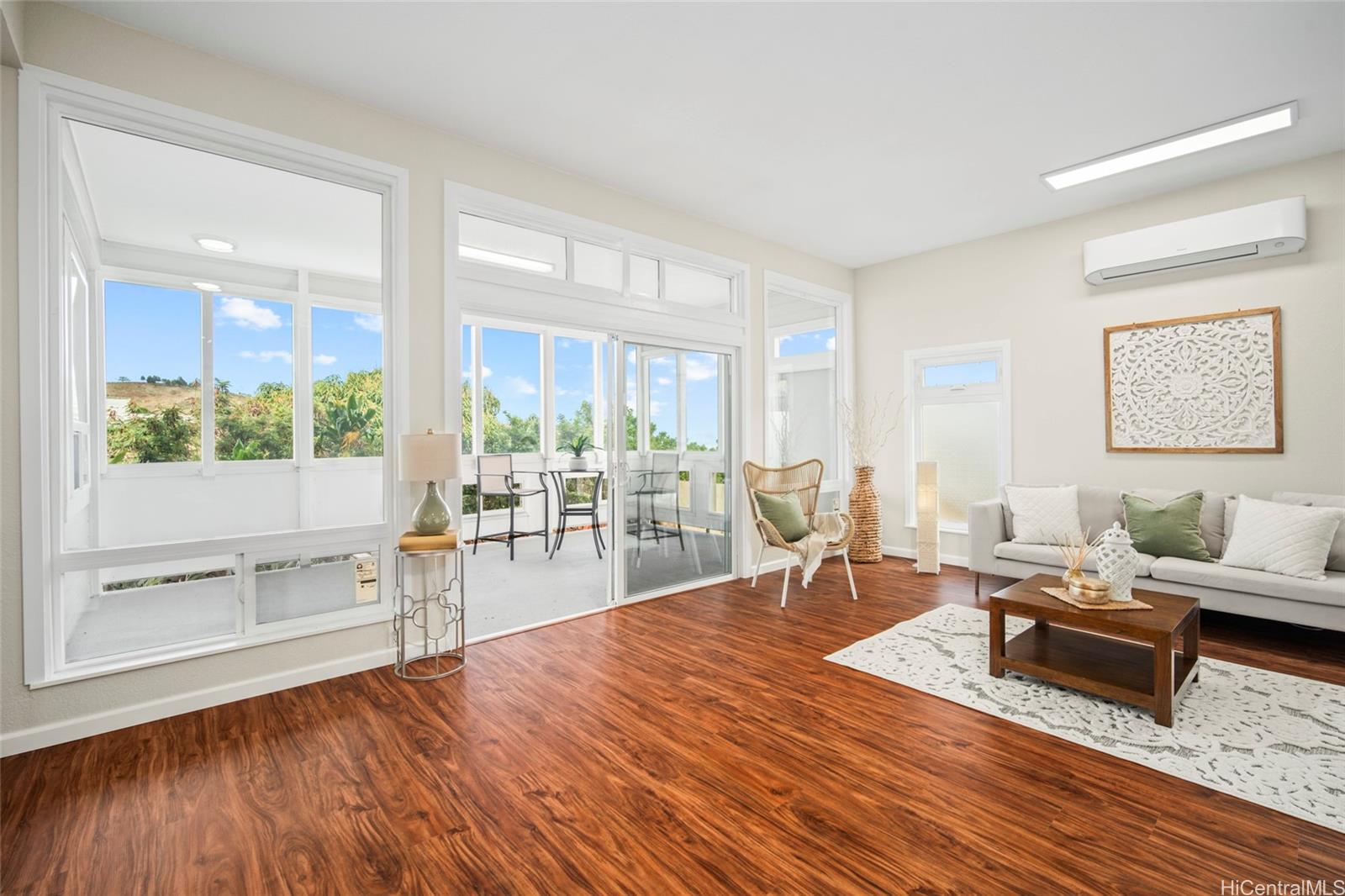 Living room with lanai/sunroom