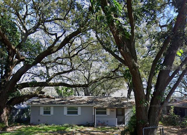 a view of house with a tree