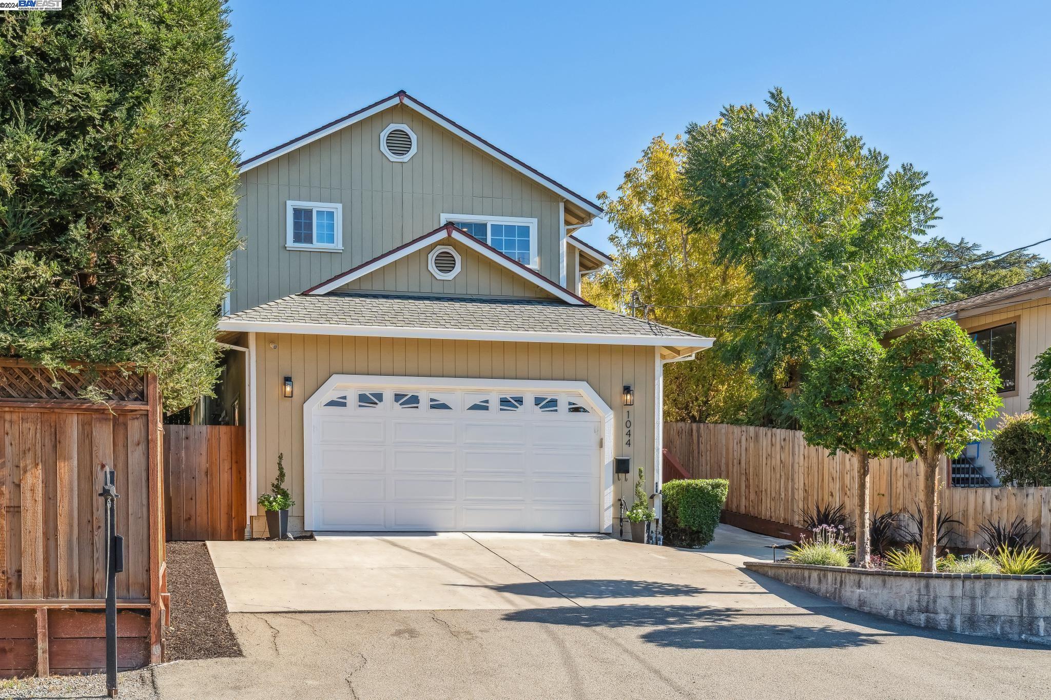 a front view of a house with a garage