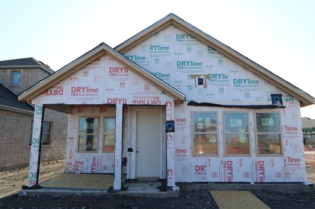 a front view of a house with yard