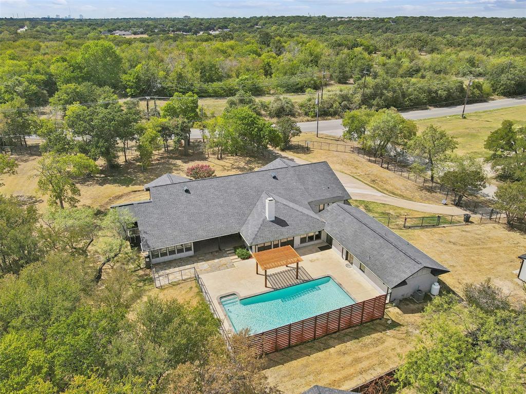 an aerial view of residential houses with outdoor space