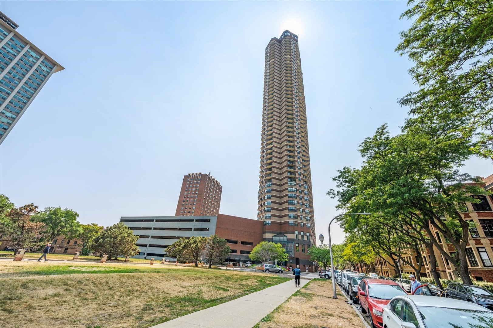 a view of a tall building from a backyard