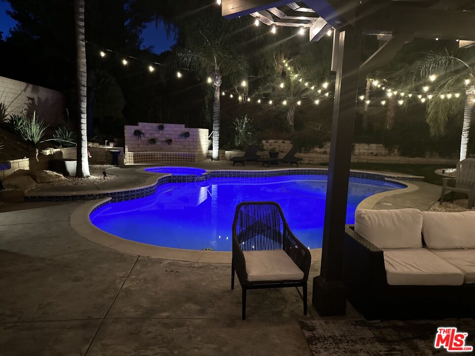 a view of swimming pool outdoor seating